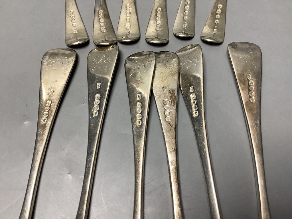 A set of six George III Old English silver dessert spoons, London 1805, Samuel Godbehere, Edward Wigan & James Boult and six Victorian Old English silver dinner forks, approximately 18oz